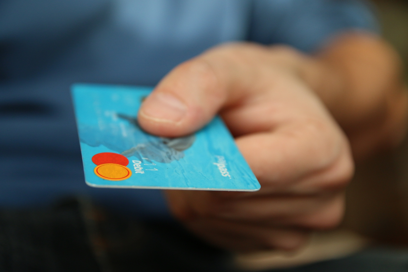 Man holding bank card