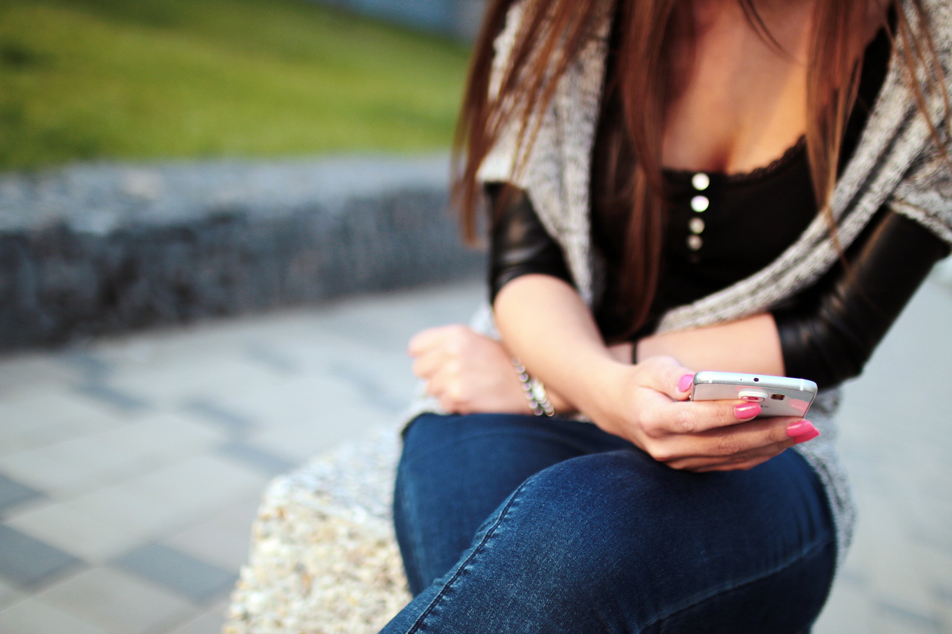 Woman with smartphone in hand